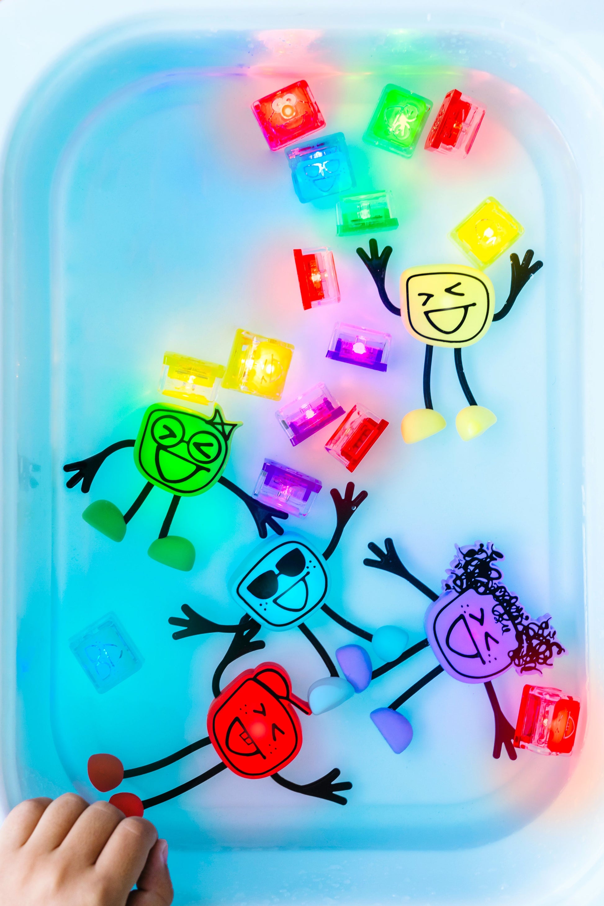 Glo_Pal_Cubes_brightly_lit_up_in_sensory_tub_with_water