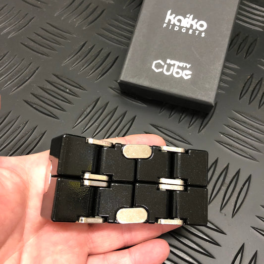 Kaiko_Metal_Infinity_Cube_Fidget_214gms_in_persons_hand