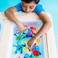 Jelly_stone_Boy_playing_wth_Glo_Pals_tub_of_brightly_coloured_glo_pal_cubes_and_characters_in_sensory_tub