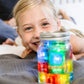 Jelly_stone_Girl_playing_with_jar_of_brightly_coloured_glo_pal_cubes