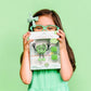 Jelly_stone_designs_Glo_pal_Character_Pippa_Green_in_packagin_held_by_girl_in_matching_green_glasses