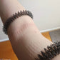 Kaiko_Wrist_Spikey_black_indents_in_arm