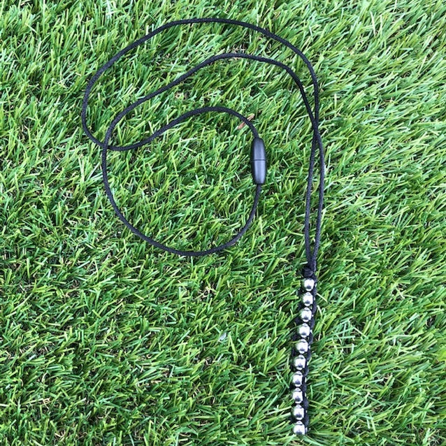 Kaiko_Caterpillar_Unisex_Necklace_black_on_grass