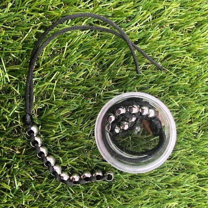 Kaiko_Caterpillar_hand_fidget_black_in_case_and_outstretched