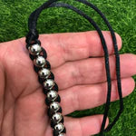Kaiko_Caterpillar_hand_fidget_black_in_persons_hand