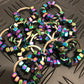 Kaiko_Hexa_oil_slick_XL_large_pile_on_metal_background