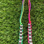 Kaiko_Silkworm_fidget_for_the_hand_rainbow_and_hot_pink