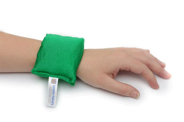 Sensory_Matters_Lycra-fidget-cuff-green_on_persons_wrist