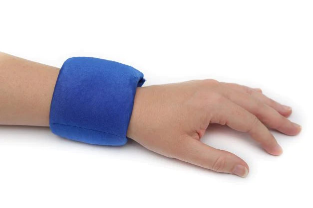 Sensory_Matters_Lycra_fidget-cuff_royal_blue_on_persons_wrist