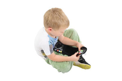 Sensory_Matters_Child_playing_with_Marble_Maze_run_Black