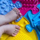 Muffik_Sensory_play_mats_medium_Set_2_close_up_of_baby_feet_and_mat_textures