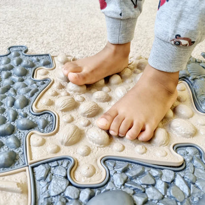 Muffik_Sensory_play_mat_natural_set_cloae_up_of_mats_with_child_standing_on_them
