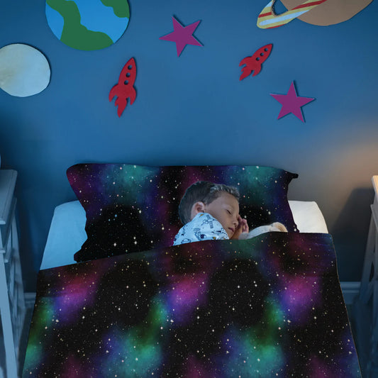 Boy_tucked_into_bed_in_Calmcare_Night_Sky_Sensory_Compression_Bed_Sheet