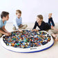 Play_Pouch_Capitain_Blue_kids_sitting_around_open_pouch_playing_with_lego