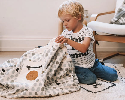 Play_pouch_Wow_Town_interactive_toy_pouch_child_packing_up_toys_into_pouch