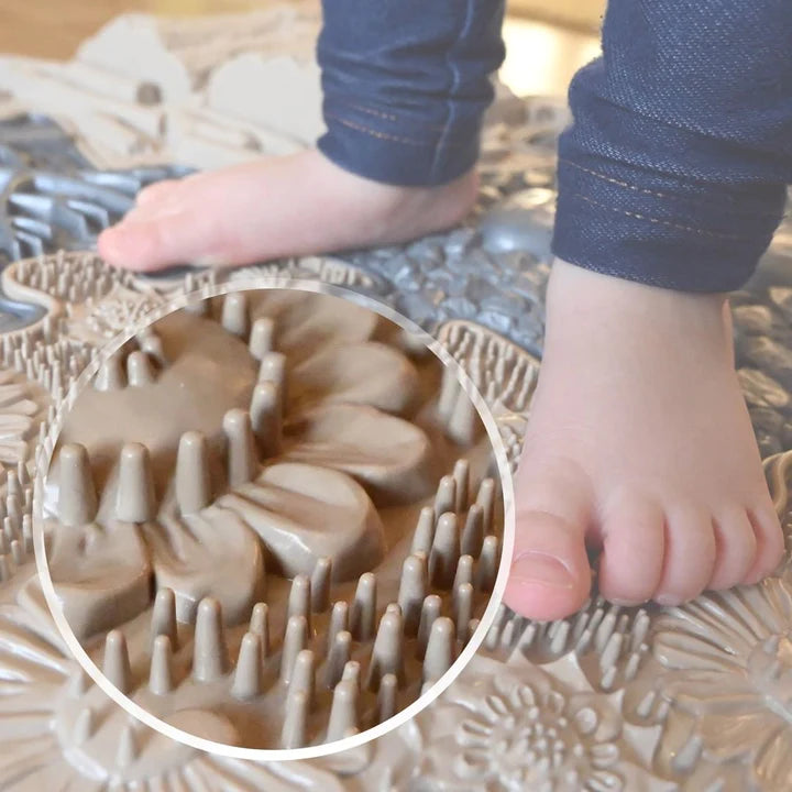 Muffik_Sensory_play_mat_natural_set_close_up_of_mat_with_child_standing_on_it