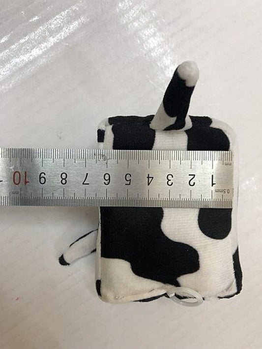 Senseez_hand_held_draw_cord_pull_vibrating_massager_cow_next_to_ruler_seven_centimeters_wide