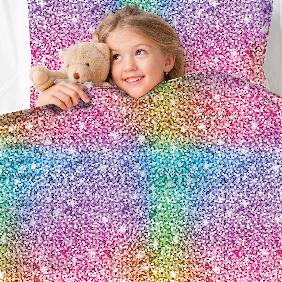 girl_tucked_up_in_bed_in_CALMCARE_Sparkles_Sensory_Compression_Bed_Sheet