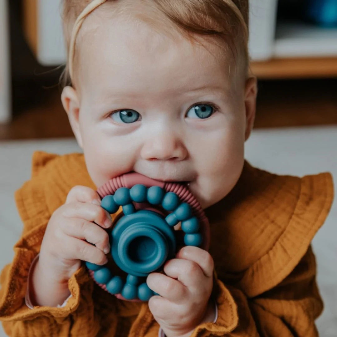 Baby_chewing_Jelly_Stone_Designs_Rainbow_Stacker_and_Teether_Toy_