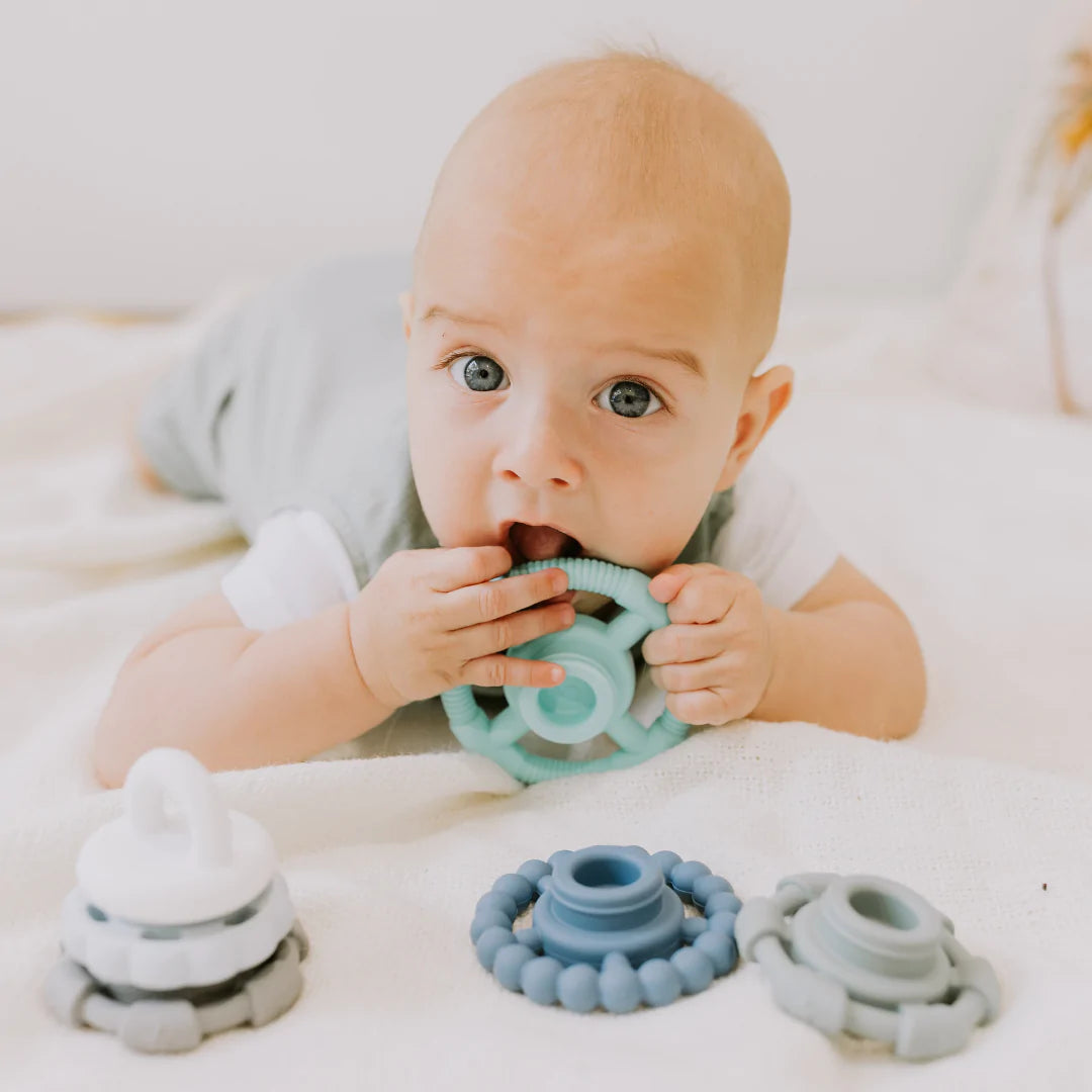 Baby_chewing_Ocean_Jelly_Stone_Designs_Stacker_and_Teether_Toy_