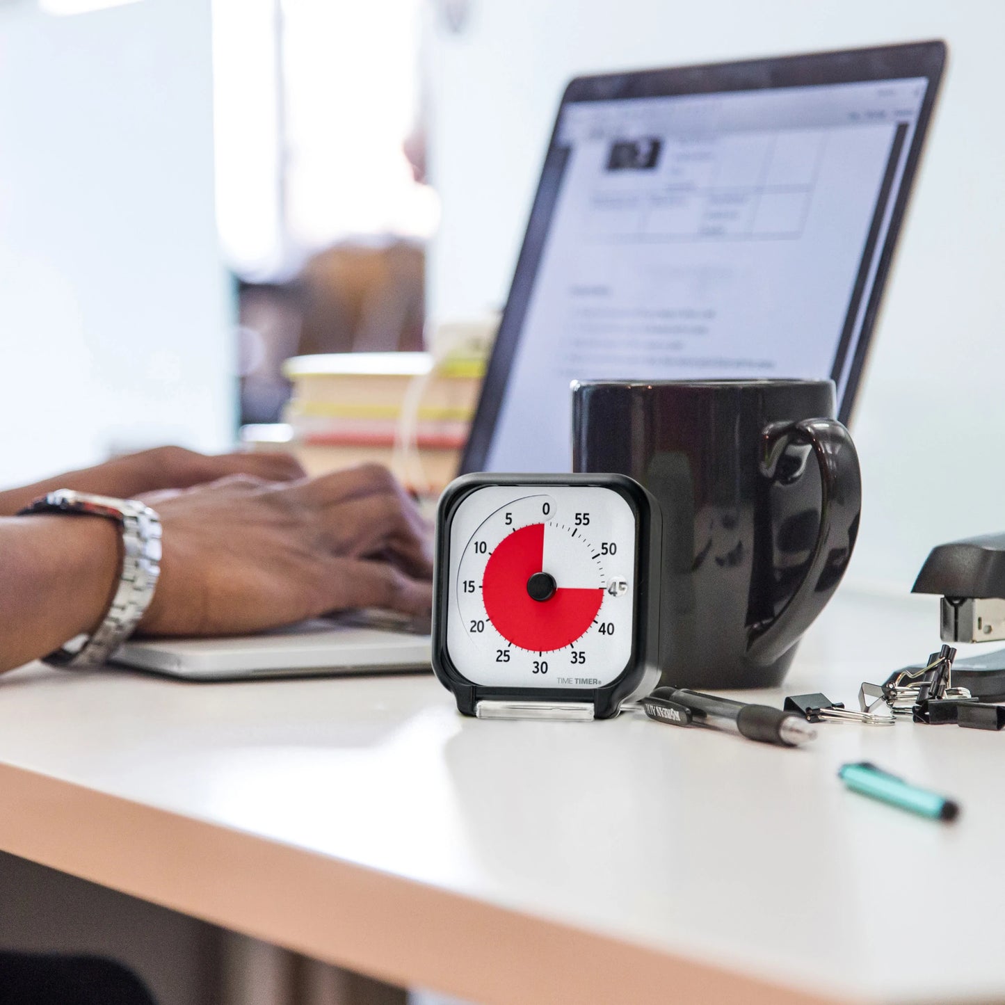 Time_Timer_Original_Visual_3_inch_black_Person_working_on_computer_with_timer_alongside_showing_45_minutes