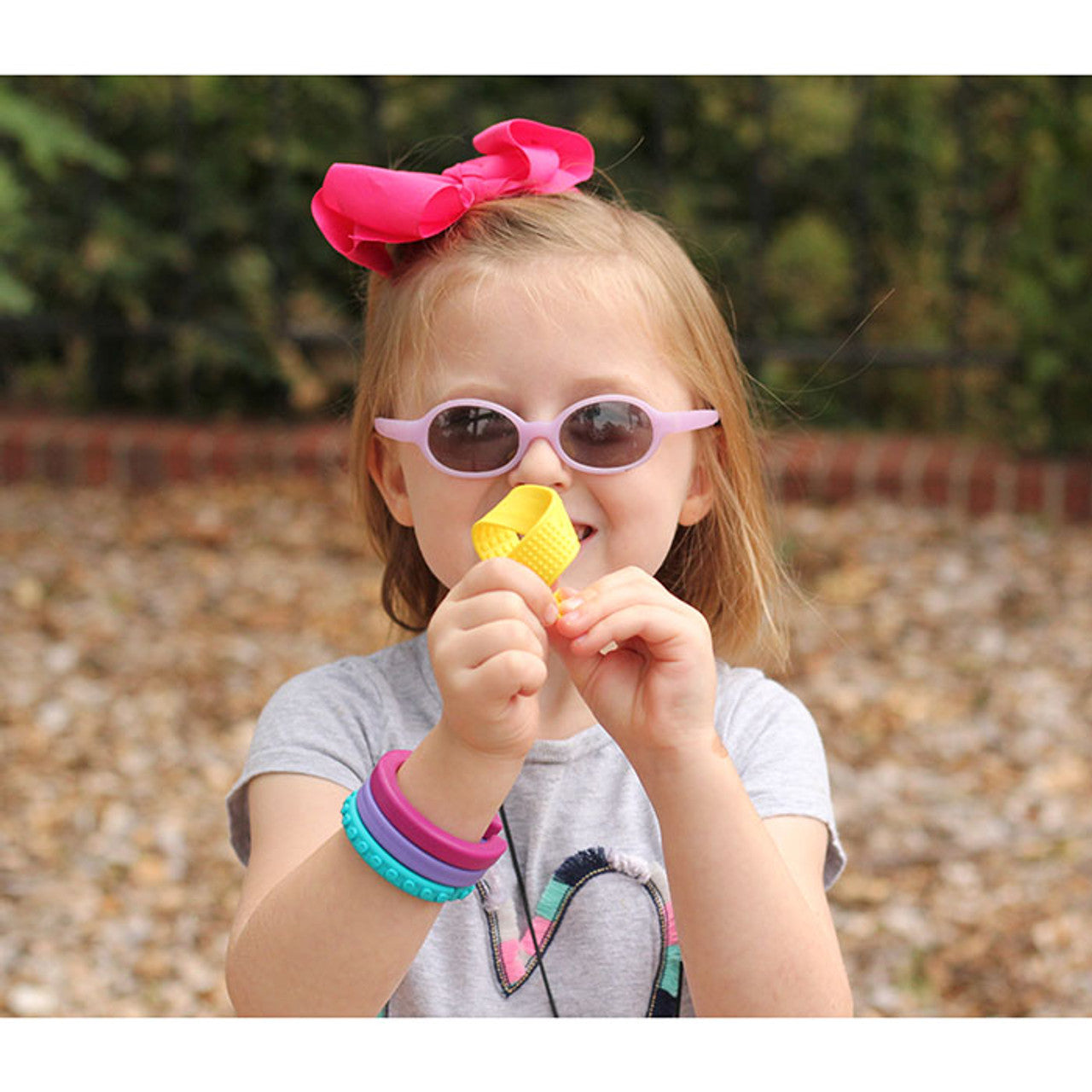 girl_fidgeting_and_bending_ARK's_Sensory_Bookmark /_Fidget