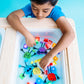 Boy_playing_wth_Glo_Pals_tub_of_brightly_coloured_glo_pal_cubes_and_characters_in_sensory_tub
