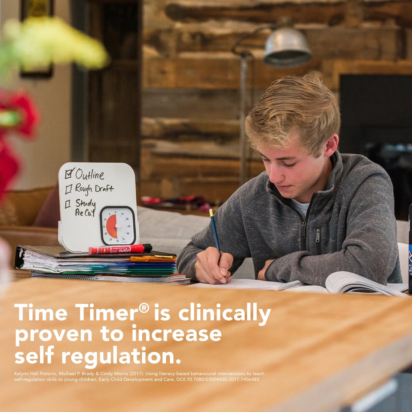 Time_Timer_Edication_edition_mod_with_dry_erase_board_being_used_by_boy_studying_timer_set_to_30_minutes