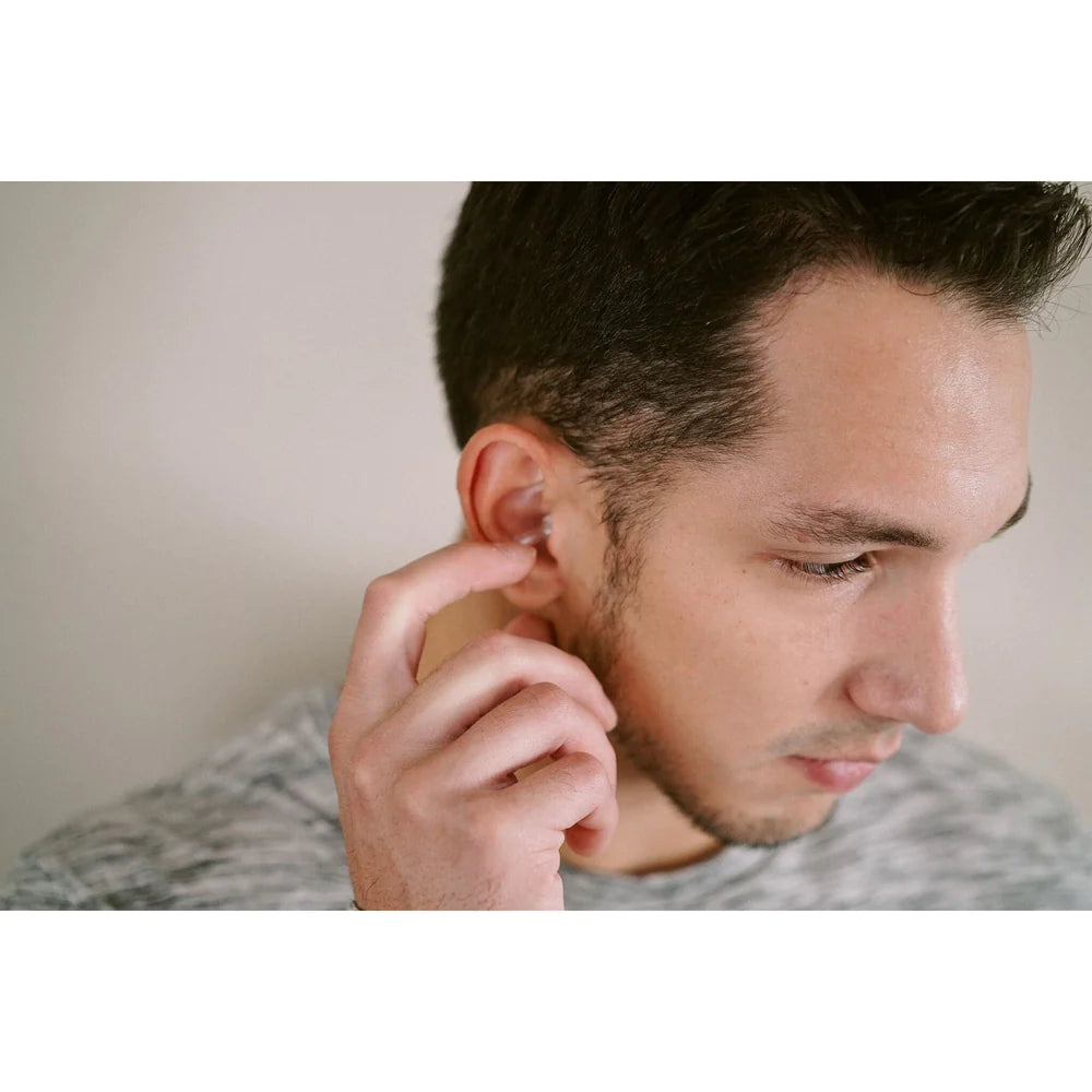 Vibes_being_put_into_mans_ear